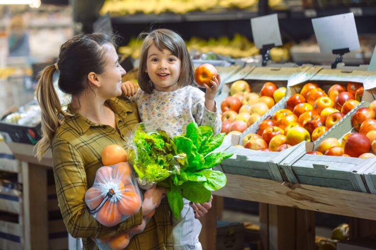 family supermarket beautiful young mom her little daughter smiling buying food concept healthy eating harvest scaled 2