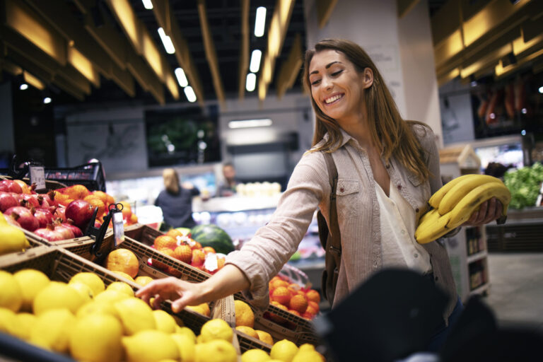 female buying food supermarket grocery store scaled 2